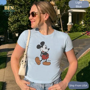 May include: A set of three ceramic mugs with a speckled, matte finish. The mugs are in shades of cream, light gray, and dark gray. Each mug has a simple, minimalist design, perfect for coffee or tea.