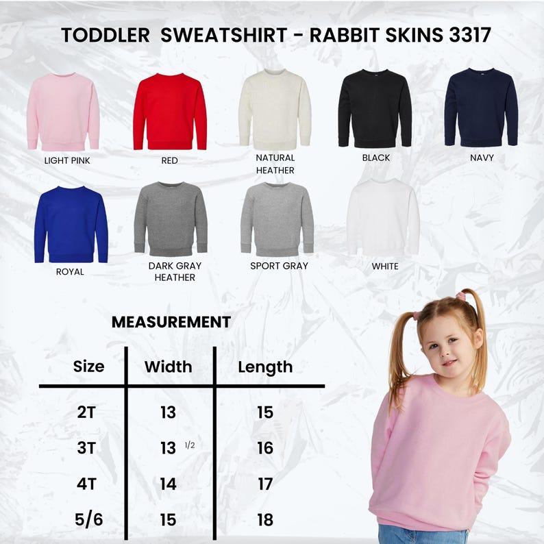 May include: A light pink toddler sweatshirt from Rabbit Skins, with a measurement chart showing sizes 2T to 5/6. The image displays various colors, including red, black, navy, royal blue, and gray. The text "TODDLER SWEATSHIRT - RABBIT SKINS 3317" is at the top.