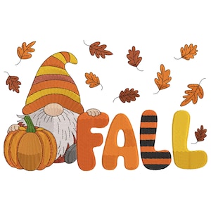May include: A whimsical fall-themed design featuring a gnome with a pumpkin and the word "FALL". The gnome wears an orange and yellow striped hat. The pumpkin is orange with a green stem. Brown leaves are scattered around the design.