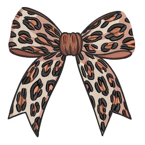 May include: A decorative bow with a leopard print design. The bow features a tan background with black and brown spots, and a brown center knot. The edges are outlined in black.