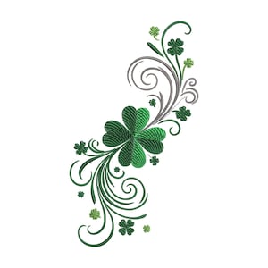 May include: An embroidered design featuring a cluster of green shamrocks and swirling vines. The shamrocks have a textured appearance, and the design includes smaller shamrocks and decorative elements. The color palette is primarily green with accents of gray.