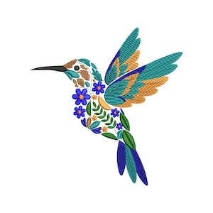 May include: A colorful embroidered hummingbird design. The bird features teal, blue, and gold wings, a long black beak, and a body adorned with blue flowers, leaves, and brown patterns. The design is set against a white background.