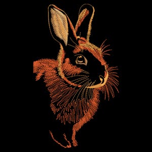 May include: An embroidered design of a rabbit's head and upper body, rendered in shades of orange and gold against a black background. The rabbit's fur is detailed with intricate stitching, and its eye is visible. The design is a detailed illustration.