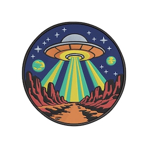 May include: Embroidered patch featuring a UFO beaming down light beams onto a desert landscape. The patch has a circular shape with a dark blue background, orange, red, and yellow details, and a black border.