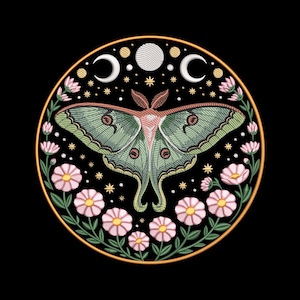 May include: Circular design featuring a green and red moth with intricate wing patterns, surrounded by pink flowers, crescent moons, stars, and a full moon. The design is set against a black background with a gold border, creating a celestial and botanical theme.