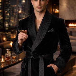 May include: A black velvet dressing gown with a quilted shawl collar and cuffs. The gown has a matching belt and a pocket. A lit cigar is held. The background shows a city skyline at night.