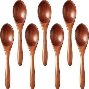 May include: Seven wooden spoons with a rich, warm brown color. The spoons have a classic oval bowl shape and long, slender handles. The spoons are arranged in a symmetrical pattern, showcasing their natural wood grain.
