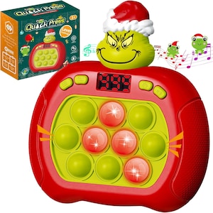 May include: A red and green Quick Press game console featuring a Grinch character wearing a Santa hat. The game has green and red buttons, a digital display, and a box with the game's name and graphics.