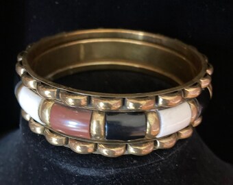 Set of three brass bangles - two thin solid brass - one thicker with tan, brown and black plastic tile inlays