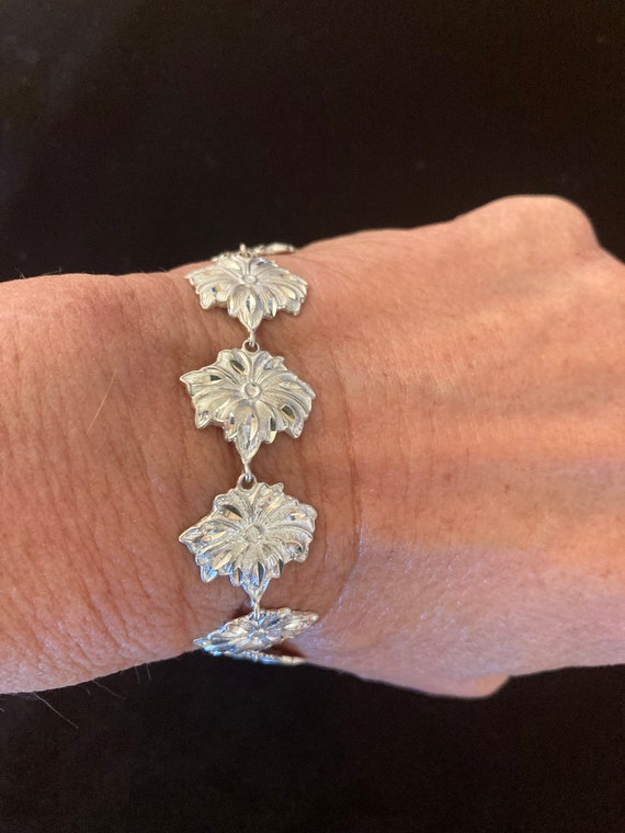 Diamond cut sterling floral link bracelet
