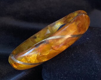 Foiled resin bangle-orange-golden-swirls-looks like fire opal-opalescent-gold tone ribbon