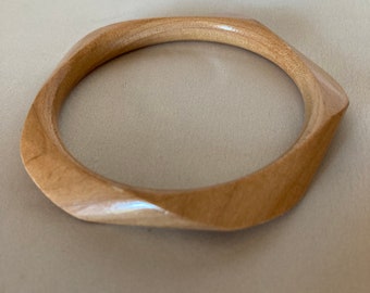 Maple wood bangle ~ beveled twist ~ solid piece natural wood ~ varnished