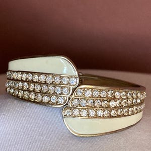 Cream enamel and pave&#39; rhinestone hinged bangle bracelet