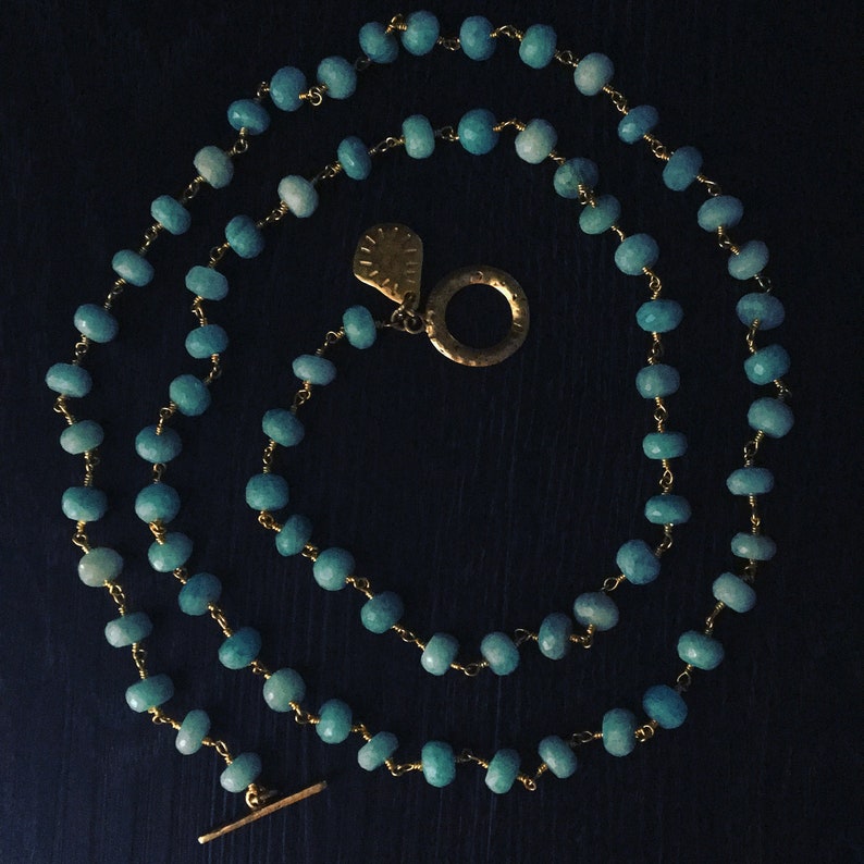 Beautiful blue larimar gemstones with gold Long necklace or five wrap bracelet.