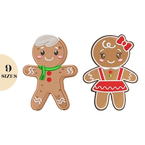 以下が含まれることがあります： 2つの刺繍されたジンジャーブレッドクッキーのデザイン。1つは緑色のスカーフを着たジンジャーブレッドマンで、もう1つは赤いリボンとドレスを着たジンジャーブレッドウーマンです。画像には、円の中に「9サイズ」というテキストも含まれています。