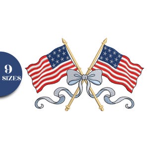 May include: Embroidered design featuring two crossed American flags with red and white stripes and blue star fields. A light blue bow and ribbons are centered between the flags. The text "9 SIZES" is in a blue circle.
