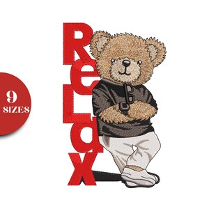 May include: An embroidered design features a brown teddy bear wearing a black jacket and white pants, holding glasses. The word "Relax" is vertically displayed in red letters. A red circle with the text "9 SIZES" is on the left.