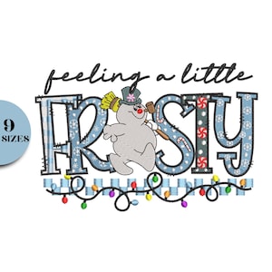 May include: A whimsical design featuring the phrase "feeling a little frosty" in black script above the word "frosty" in blue, decorated with snowflakes and candy canes. A snowman with a broom and mallet is also featured. A string of colorful lights is at the bottom.