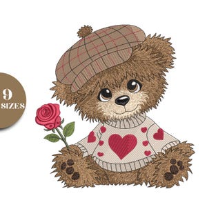 May include: A charming teddy bear illustration wearing a plaid cap and a sweater with a large red heart and smaller hearts. The bear holds a red rose, with a friendly expression. The design is suitable for embroidery or applique.