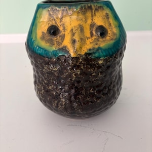 May include: A set of three ceramic mugs with a speckled, matte finish. Each mug is a different colour: light blue, cream, and grey. The mugs have a simple, modern design and a comfortable handle.