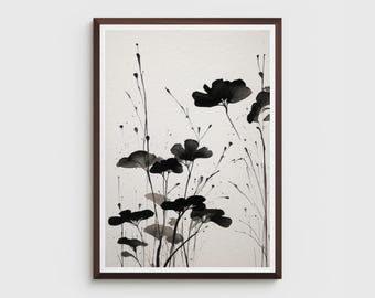 May include: A framed art print featuring a black and white floral watercolor painting. The artwork depicts stylized flowers and stems with ink splatters against a neutral background. The frame is a dark brown color.