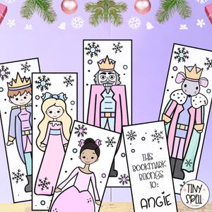 Peut inclure: Un ensemble de cinq marque-pages rectangulaires illustrés de dessins animés représentant un prince, une princesse, un casse-noisette, un roi souris et un modèle vierge avec le texte This bookmark belongs to: Angie, ornés de flocons.