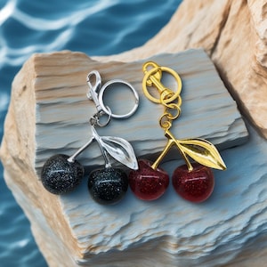 Cute Cherry Keychain Set – 1 Red and 1 Black – Bling Bag Charms for Women & Girls, Stylish Gift for Birthday or Christmas