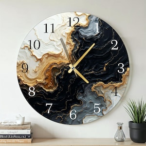 May include: Round wall clock with a marbled design in black, white, gold, and gray. The clock face features large white numerals and gold-colored hands. The clock is a decorative item for home decor.