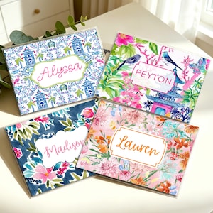 May include: Four personalized coasters with floral and patterned designs. Each coaster features a name: Alyssa, Peyton, Madison, and Lauren. The coasters have a clear, protective coating and are arranged on a white surface.