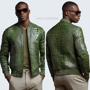 May include: A green bomber jacket featuring a textured crocodile skin pattern, a ribbed collar, ribbed cuffs, and a front zip closure. The jacket is displayed from both the front and back views, with the text DALEATHERPK visible in the centre.