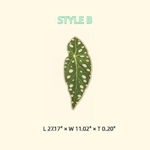May include: A green leaf-shaped patch with white spots and a beige border. The patch is labeled "STYLE B" in green text. The dimensions are 27.17" long, 11.02" wide, and 0.20" thick. The patch is likely for decorative purposes.