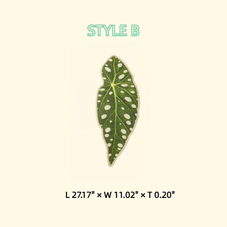 May include: A green leaf-shaped patch with white spots and a beige border. The patch is labeled "STYLE B" in green text. The dimensions are 27.17" long, 11.02" wide, and 0.20" thick. The patch is likely for decorative purposes.
