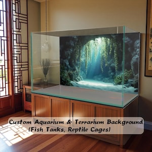 May include: A large rectangular glass aquarium tank featuring a custom background print of a dark rocky cave interior with hanging green vines and light rays. The tank sits on a wooden cabinet with four doors and a flat top surface.