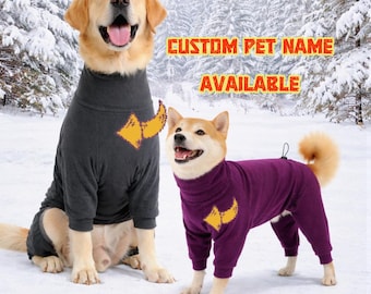 May include: Two dogs wearing matching dog pajamas. One dog is wearing gray pajamas, and the other is wearing purple pajamas. Both sets of pajamas have a yellow design on the chest. The text "CUSTOM PET NAME AVAILABLE" is in the background.