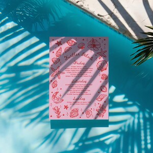 May include: A pink rectangular card with the words "Further Details" and event information, surrounded by red seashell and starfish illustrations. The card is set against a blue water background with palm frond shadows.