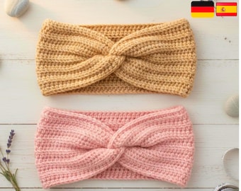 May include: Two handmade crochet headbands. One is a light tan colour, and the other is a soft pink. Both headbands have a twisted knot design in the centre. The headbands are displayed on a light wood surface with small decorative stones.