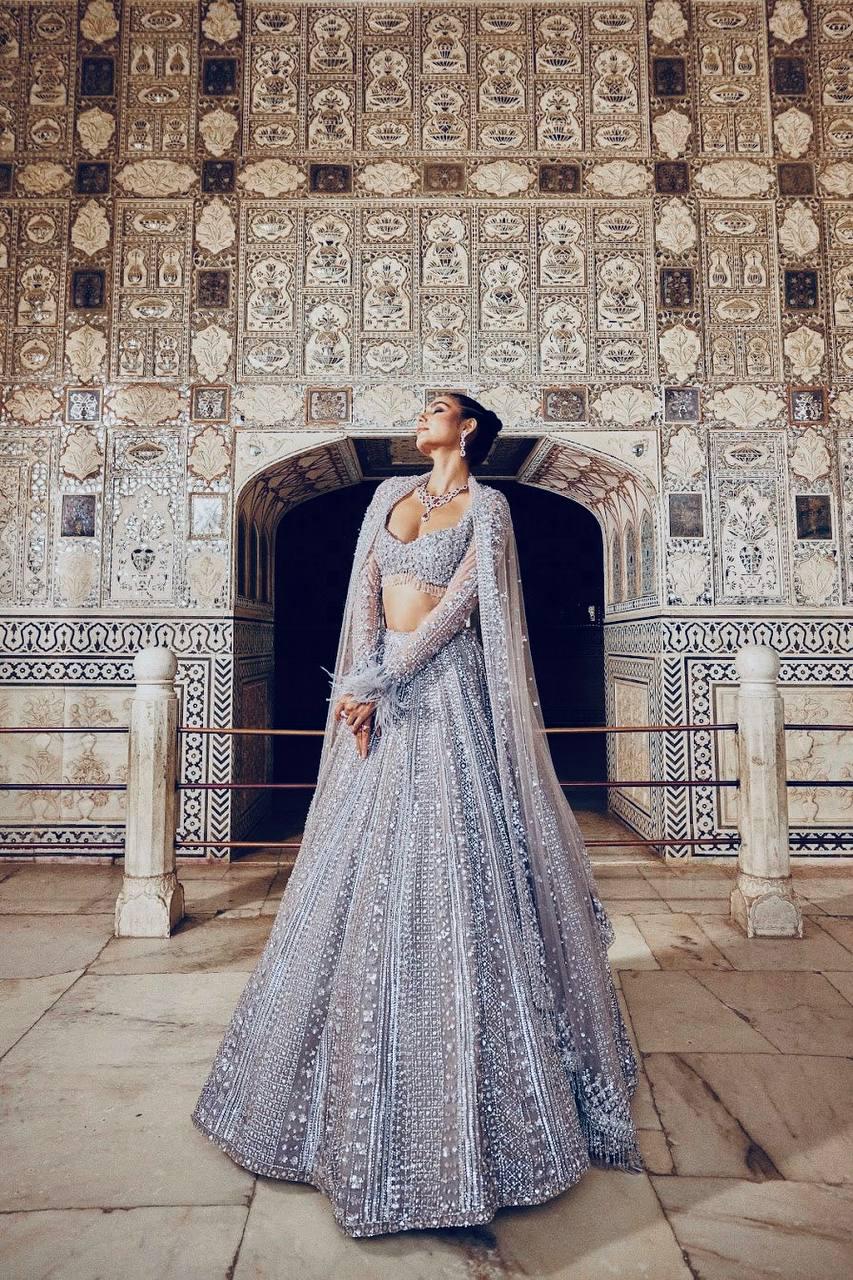 silver indian wedding dress Delicately crafted white and silver bridal look. The 3 part set takes  inspiration from French florets over a soft cotton colored net canvas.  Lehenga comes lined with silver and white jacquard. #Netfabricbridal #