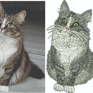May include: A tabby cat with brown and white fur, sitting and looking upwards. The cat has yellow eyes and a white chest. Next to it is an embroidered image of a similar cat in shades of grey.