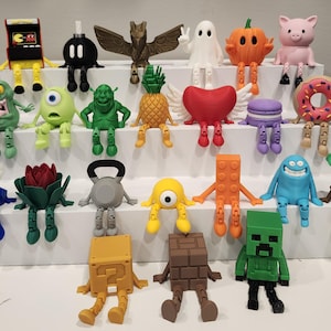 May include: A white ceramic mug with a black handle and the text "But First, Coffee" in a handwritten style. The mug is on a white surface. The mug is approximately 4 inches tall.