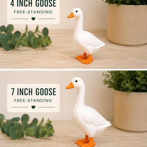 May include: Two white goose figurines with orange beaks and feet. The top image is labeled 4 INCH GOOSE FREE-STANDING and the bottom image is labeled 7 INCH GOOSE FREE-STANDING. Text at the bottom states: This goose stands on its own&mdash;no base included.