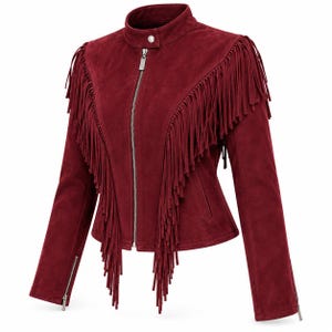 May include: A deep burgundy suede jacket featuring a stand-up collar with a single snap button, a full-length silver-tone front zipper, and long fringe detailing across the chest and shoulders. The sleeves include silver-tone zippered cuffs.