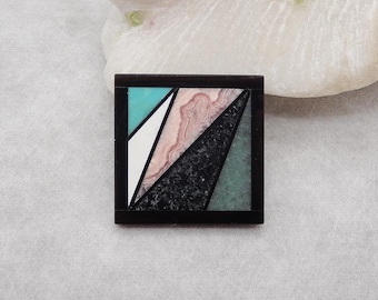 May include: Square, geometric mosaic with a black border. The mosaic features a turquoise triangle, a white triangle, a pink and white patterned triangle, a black triangle, and a green triangle. The mosaic is set against a white background.