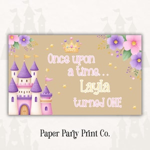 May include: A rectangular birthday party invitation with a fairytale theme. The design features a purple and pink castle, floral accents, and the text "Once upon a time... Layla turned ONE."
