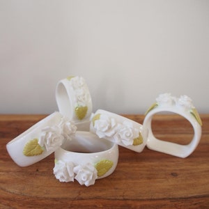 Vintage ceramic napkin rings with white roses