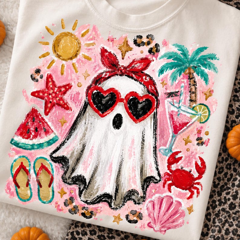 May include: White sweatshirt with a colorful graphic of a ghost wearing heart-shaped sunglasses and a red bandana. The design includes a watermelon slice, starfish, flip-flops, a cocktail, and a palm tree, all set against a pink background.