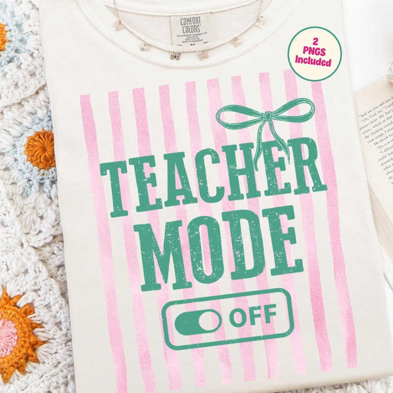 May include: Cream-colored t-shirt with pink vertical stripes and the text "TEACHER MODE OFF" in green. A green bow graphic is above the text. A delicate butterfly necklace is at the neckline. The shirt includes a tag that says "2 PNGS Included".