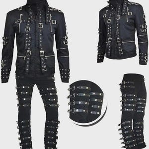 May include: Black jacket and pants set featuring multiple straps with silver buckles and zippers. The jacket has a high collar and the pants have straps around the legs. The set is made of a dark, possibly leather-like material.