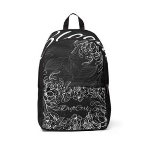 Step into style with the DriftCtrl “Bloom” Backpack – where urban streetwear meets gothic floral design.