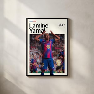 May include: Framed poster featuring a soccer player in a blue and red jersey with the number 10. The player is raising his arms in celebration. The poster includes the name "Lamine Yamal" and the number "#10" in a bold font.