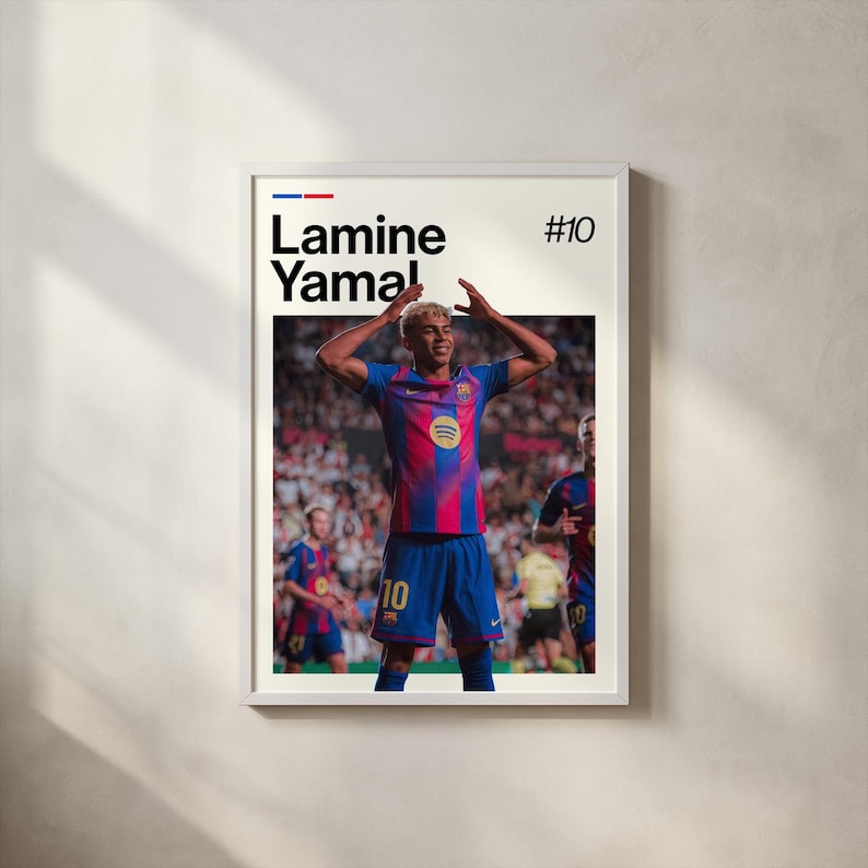 May include: Framed poster featuring a soccer player in a blue and red jersey with the number 10. The player is celebrating with arms raised. The poster includes the name "Lamine Yamal" and the number "#10" in black text.